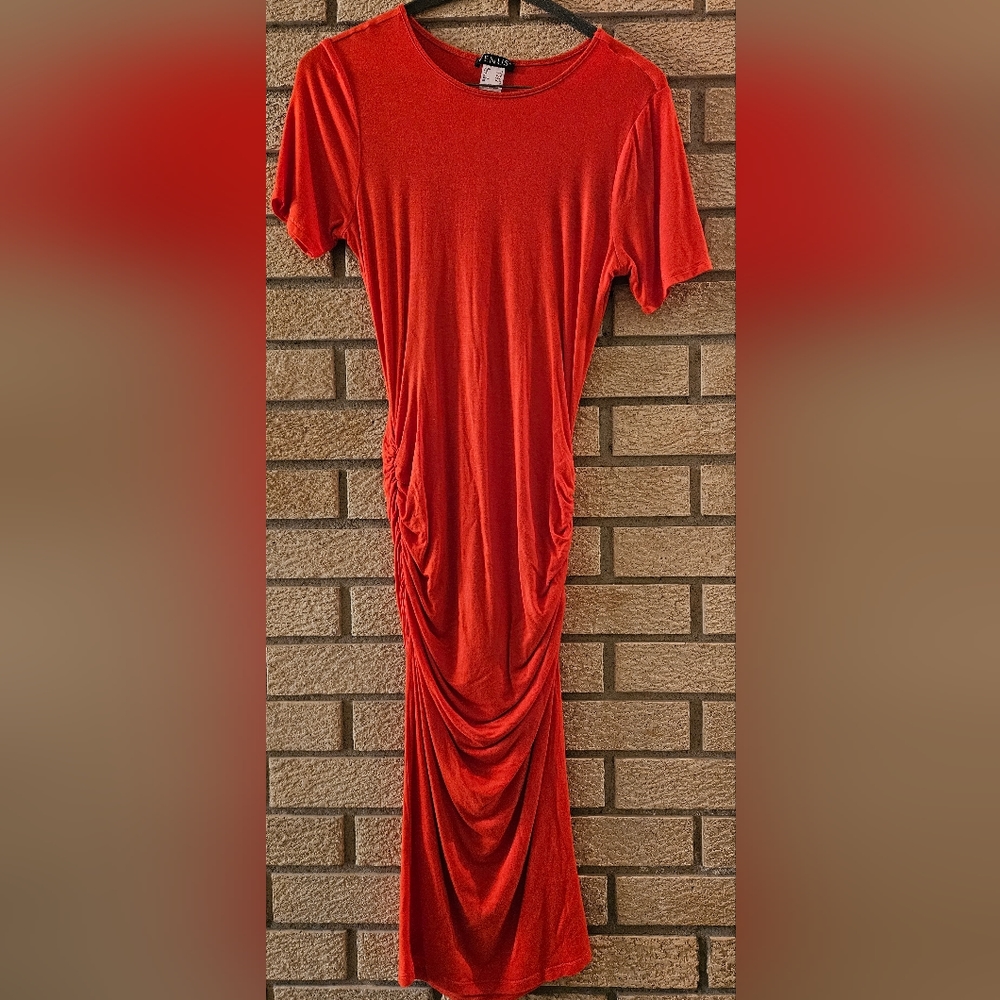 Gently worn Coral Red bodycon dress with ruched sides.  Worn once.
